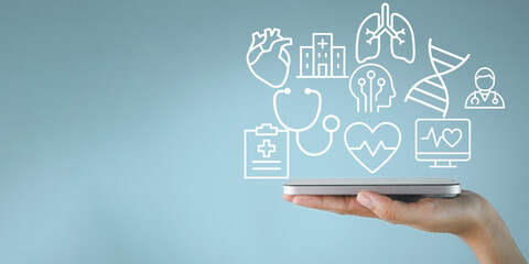 A hand holds a smartphone with a hologram of medical icons. A concept for a digital health...