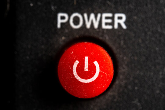 Tv red power on and off icon and button close up of a old black Television remote controller