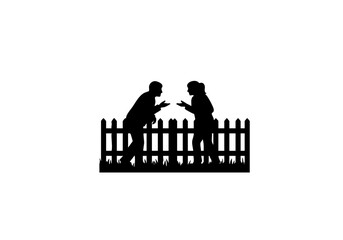 Two people having conversation beside wooden fence.