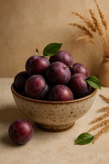 A close-up of a bowl filled with fresh, ripe plums, showcasing their vibrant colors and textures