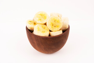 a slice banana on bowl wood