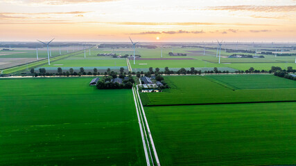 Drone view of wind farm with huge generator turbines. Sunset. Holland. Modern green technologies. © Todayphoto