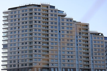 High-rise apartment building with numerous windows, daytime