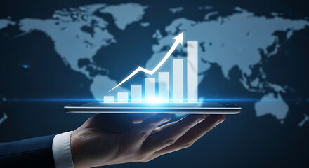 Hand holding tablet displaying financial growth chart with world map view