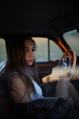 Fototapeta premium young woman driving a car