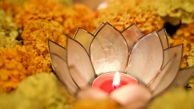Yellow flower on the table and diwali diya blowing on flawer 4k diwali footage 