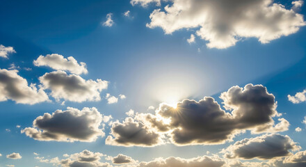 Sunbeams Piercing Through Puffy Clouds in a Vibrant Blue Sky, Creating a Beautiful and Serene Sunny Cloudscape