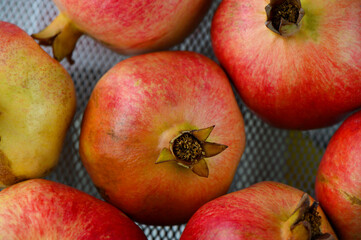 Juicy pomegranates on table, top view
