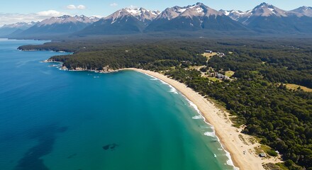 Aerial view of a scenic coastal landscape featuring sandy beach and mountains