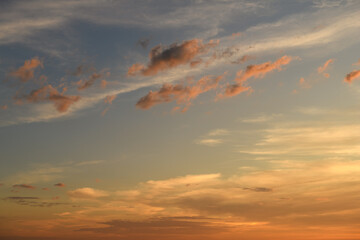 Twilight sky with glowing clouds over horizon.