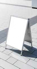 An outdoor A-frame sign with a blank white surface, ready for advertisement or information.