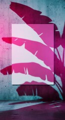 A blank white canvas on a wall with vibrant pink and blue lighting and shadows of leaves.
