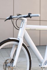 Futuristic minimalist bike for urban mobility with integrated LED strips in soft daylight