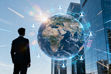 A businessman stands before a digital globe surrounded by connected user icons, symbolizing global networking and technology integration in an urban setting.