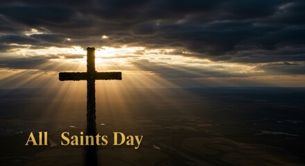 Wooden cross against a dramatic sky with sun rays shining through clouds. All Saints Day religious concept. copy space
