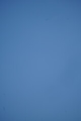 A clear, vibrant blue sky with no clouds, providing a clean and serene natural background. Perfect for themes of freedom, space, or a bright day.

