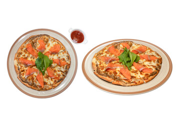Smoked Salmon Pizza Delight: Two pizzas are presented, each adorned with slices of smoked salmon, fresh basil, and a side of vibrant tomato sauce, creating a culinary composition. 