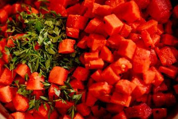 Closeup of cubed watermelon and chopped mint