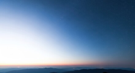 Fototapeta premium Night view of mountains under starry sky with soft light gradient