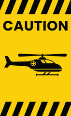 Warning sign with black diagonal stripes and the word caution above a silhouette of a helicopter