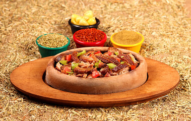 kokorech served with vegetables and spices