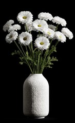 A bouquet of white daisies in a textured white vase against a black background.