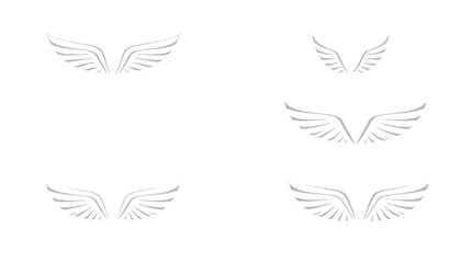 Several stylized sets of symmetrical wing illustrations arranged on a white background.