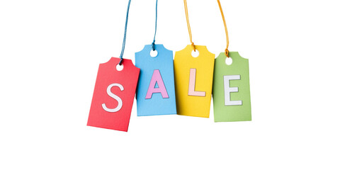 Colorful sale tags hanging against black background