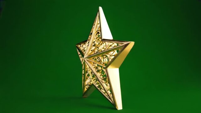 Ornate golden star with scrollwork design against a solid green background in a studio setting christmas star green screen video