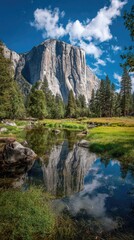 A serene natural landscape featuring a towering granite cliff reflected flawlessly in a tranquil stream, surrounded by lush greenery and a vibrant sky.