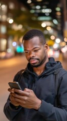 Engaging evening interaction man using smartphone urban street candid photography nighttime cityscape close-up view technology connection
