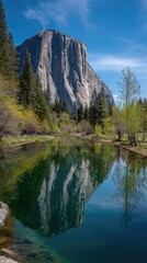 A serene landscape showcasing El Capitan's reflection in a tranquil river, vibrant greenery, and a clear blue sky.