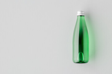Small water bottle mockup, green glass