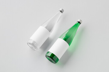 Water bottle mockup, green and clear glass, blank label