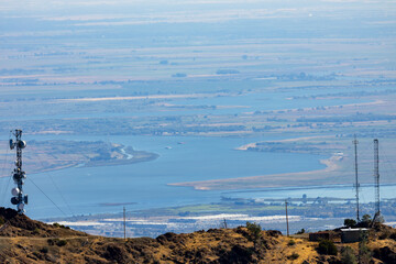 Industrial landscape and suburban neighborhoods viewed from Mount Tamalpais East Peak overlooking San Pablo Bay and the Sacramento San Joaquin Delta under clear California skies