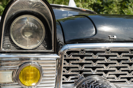 Russia, Sosnovy Bor, July 19, 2025 -Chaika gaz-13, Close-up of a gaz chaika m13 headlight, showcasing soviet automotive design