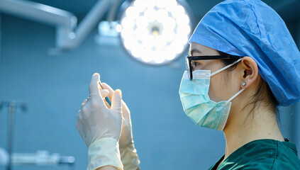 Surgeon Holding Surgical Instrument