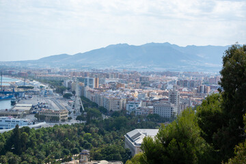 Panoramic view of a coastal city with mountains