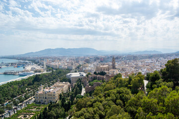 Fototapeta premium Panoramic view of a coastal city with harbor and mountains