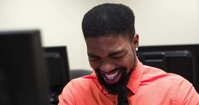 Businessman at work laughing at computer 4k