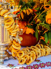 Traditional Russian ceremony - tea, samovar, bagels, bouquet of flowers on the table