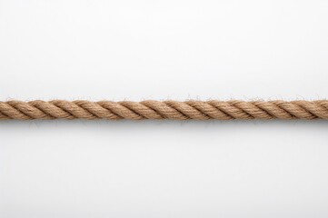A lengthy brown rope rests against a white surface, showing signs of wear and fraying.