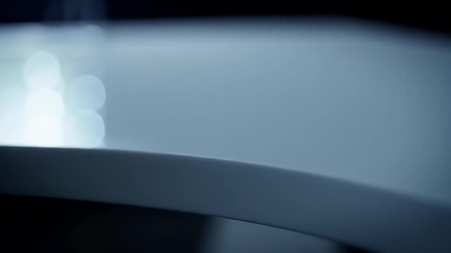 Blurred Background with white bokeh lights and dark staircase in modern studio