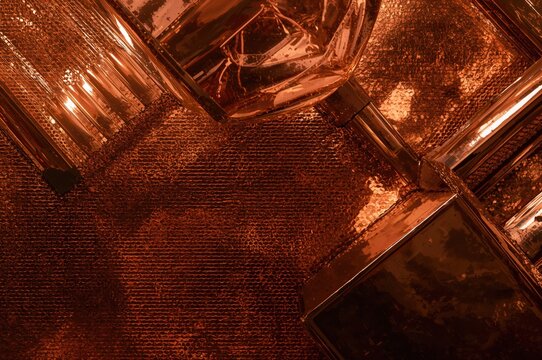 An abstract backdrop featuring metallic forms with light reflections