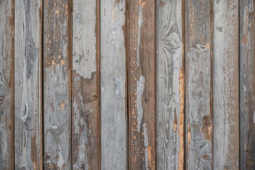 Weathered paint decorates the outer wooden boards.