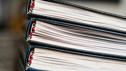 Stacked Open Books with Red Ribbons