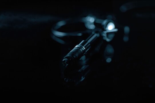 Detailed close-up of a medical proctoscope against a dark backdrop