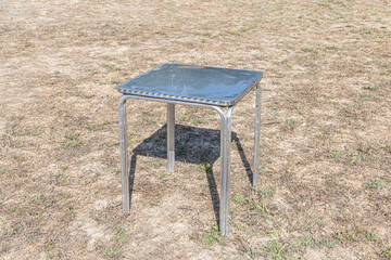 Metallic white table on the gray background