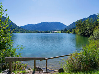 Lake of Schliersee in Bavarian Prealps in Germany. The circular path around the lake offers a view south towards Neuhaus surrounded by Mangfall massifs 
