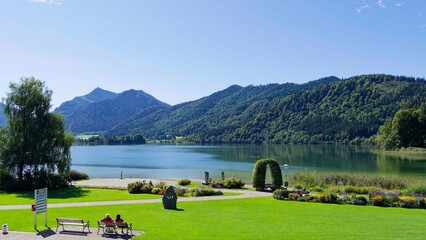Beautiful spa park of tourist town of Schliersee, northeast of Lake Schliersee in Upper bavaria Alps. Views of Mangfall mountains, Westerberg, Brecherspitz and Dürnbachwand 
